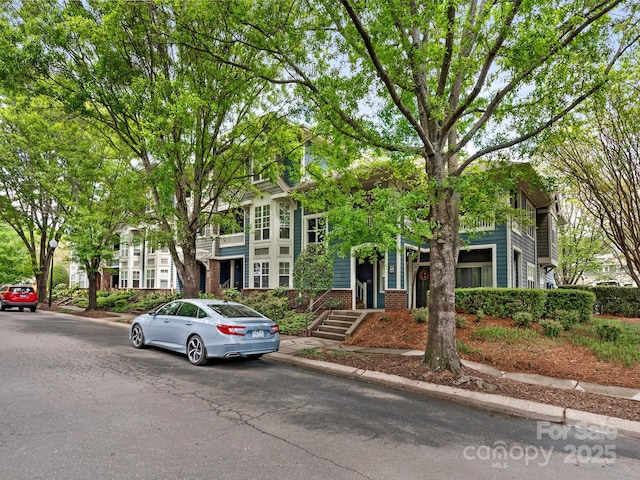 multi unit property featuring brick siding