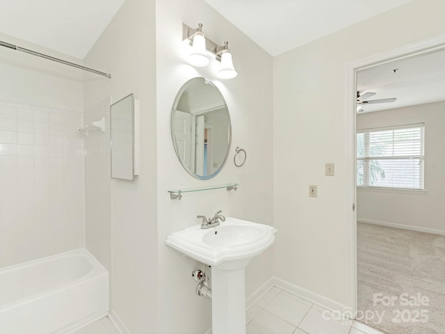 full bathroom with a ceiling fan, tile patterned flooring, shower / bath combination, a sink, and baseboards