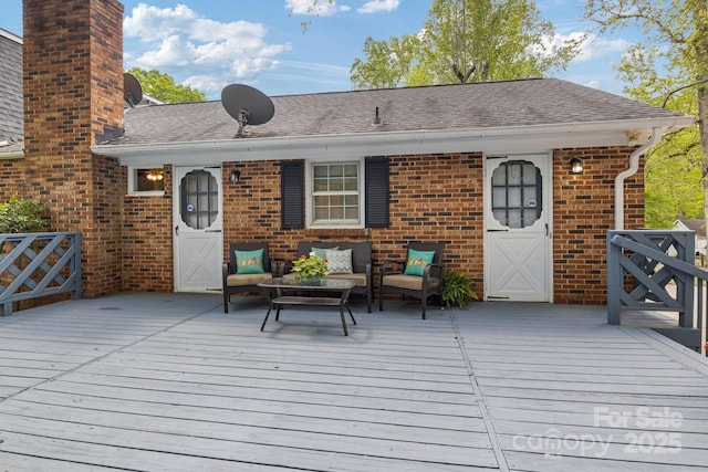 wooden deck with an outdoor hangout area