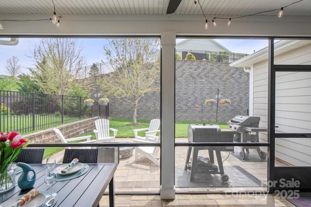 sunroom / solarium with outdoor dining area