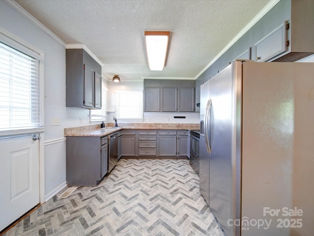 3530 Farm Lake Dr SW, Concord, NC 28027 - kitchen featuring crown molding, brick patterned floor, a sink, and stainless steel appliances