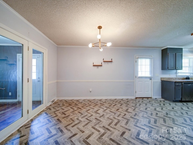3530 Farm Lake Dr SW, Concord, NC 28027 - unfurnished dining area featuring an inviting chandelier, baseboards, a textured ceiling, and ornamental molding