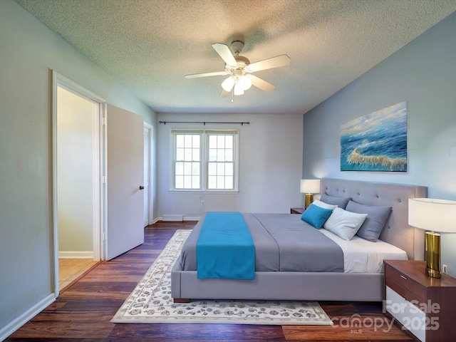 3530 Farm Lake Dr SW, Concord, NC 28027 - bedroom with a textured ceiling, wood finished floors, baseboards, and a ceiling fan