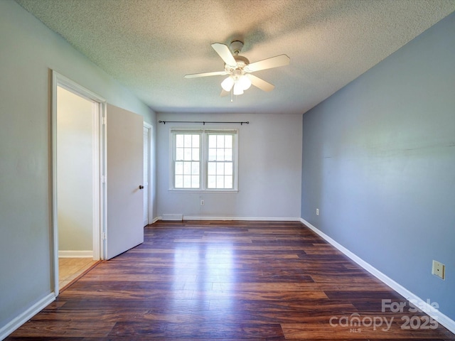 3530 Farm Lake Dr SW, Concord, NC 28027 - spare room featuring baseboards, a textured ceiling, a ceiling fan, and wood finished floors