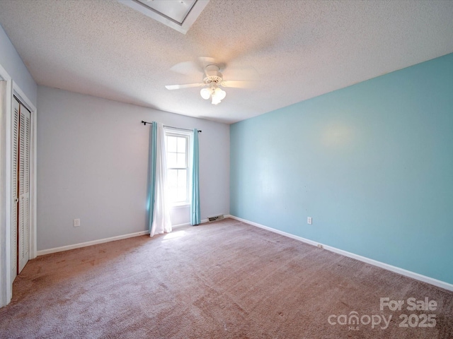3530 Farm Lake Dr SW, Concord, NC 28027 - unfurnished bedroom with a textured ceiling, a closet, visible vents, carpet floors, and baseboards