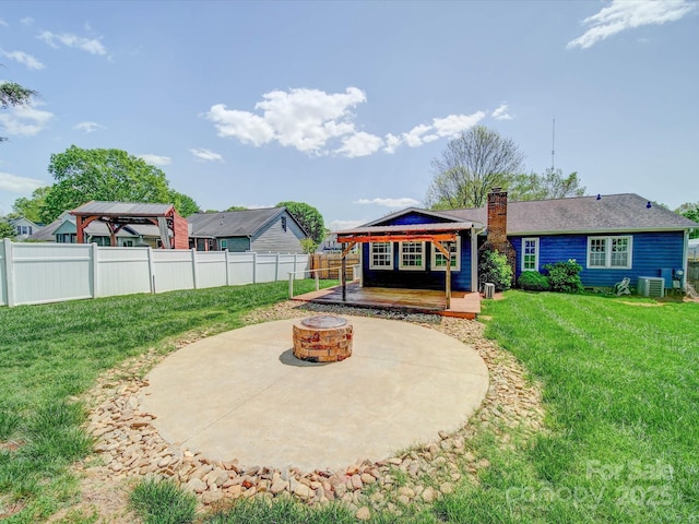 3530 Farm Lake Dr SW, Concord, NC 28027 - exterior space featuring cooling unit, a patio area, a fenced backyard, an outdoor fire pit, and a yard