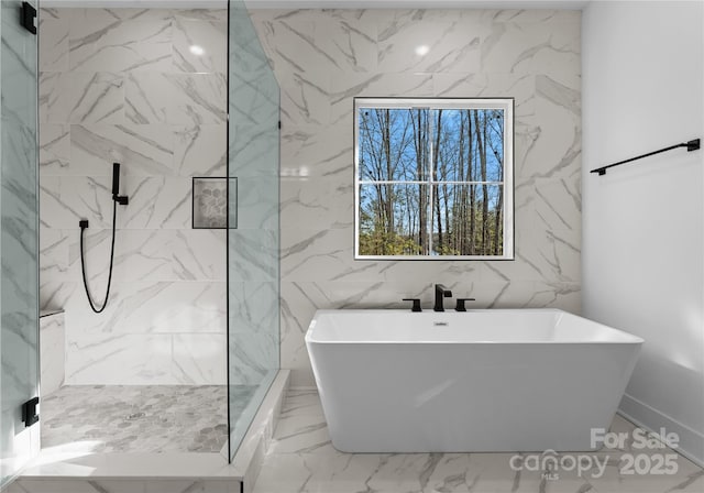 13453 Portside Ln, Lancaster, SC 29720 - bathroom with a freestanding tub, tile walls, a marble finish shower, and marble finish floor