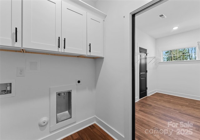 13453 Portside Ln, Lancaster, SC 29720 - washroom with cabinet space, baseboards, hookup for a gas dryer, dark wood-type flooring, and visible vents