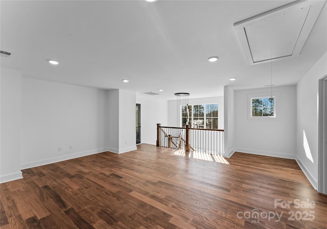 13453 Portside Ln, Lancaster, SC 29720 - spare room featuring baseboards, attic access, dark wood finished floors, and visible vents