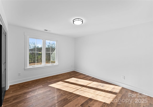 13453 Portside Ln, Lancaster, SC 29720 - empty room with visible vents, baseboards, and wood finished floors