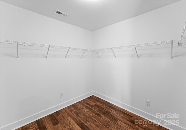 13453 Portside Ln, Lancaster, SC 29720 - walk in closet featuring dark wood-type flooring and visible vents
