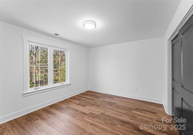 13453 Portside Ln, Lancaster, SC 29720 - unfurnished bedroom with visible vents, baseboards, and wood finished floors