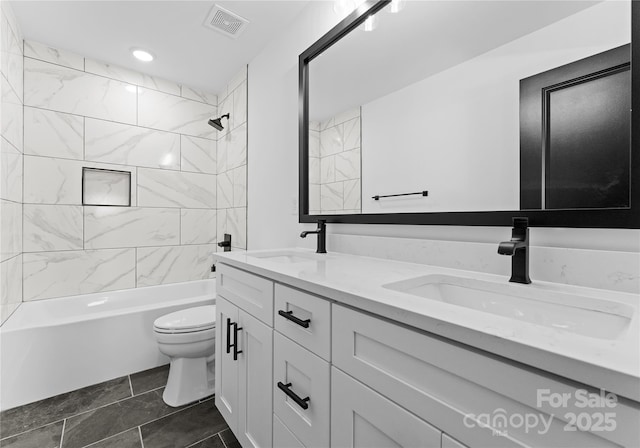 13453 Portside Ln, Lancaster, SC 29720 - full bath with visible vents, double vanity, toilet, shower / tub combination, and a sink
