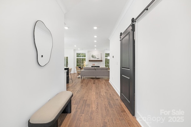 13453 Portside Ln, Lancaster, SC 29720 - hallway with crown molding, a barn door, recessed lighting, baseboards, and wood finished floors