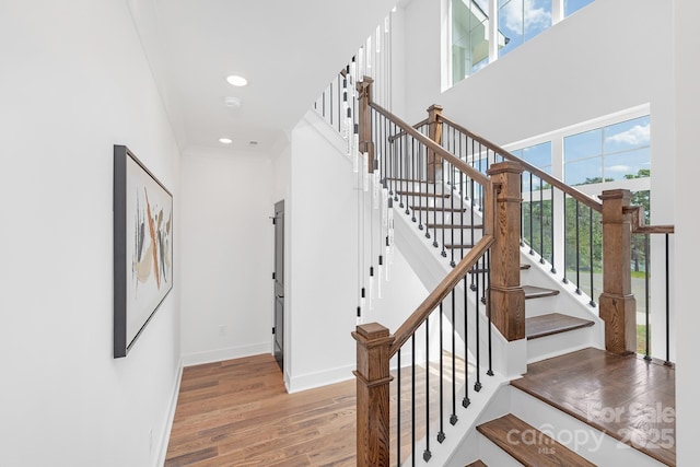 13453 Portside Ln, Lancaster, SC 29720 - staircase featuring baseboards, a high ceiling, wood finished floors, and recessed lighting
