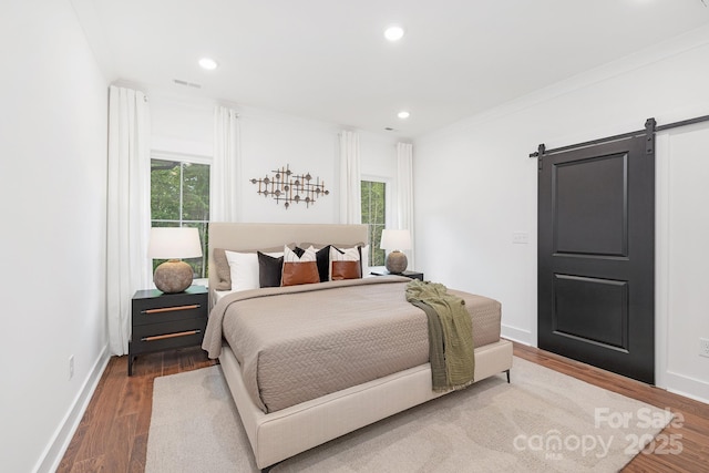 13453 Portside Ln, Lancaster, SC 29720 - bedroom featuring baseboards, recessed lighting, a barn door, and wood finished floors