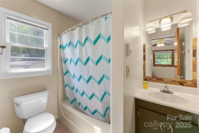 full bath featuring vanity, ceiling fan, a healthy amount of sunlight, and toilet