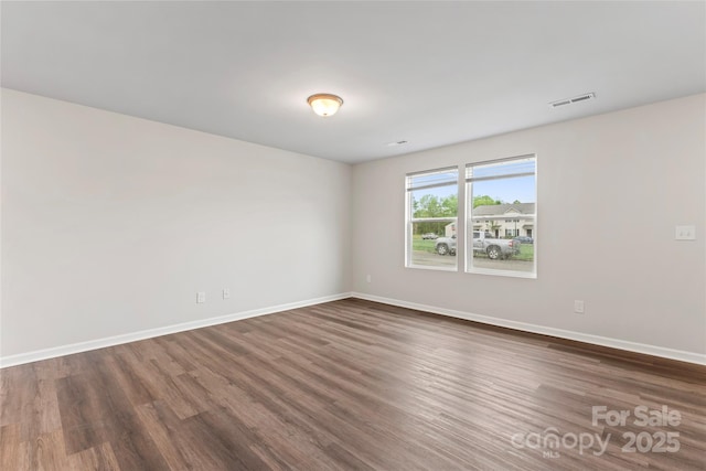 221 Century Dr, Salisbury, NC 28147 - unfurnished room with dark wood-type flooring, visible vents, and baseboards