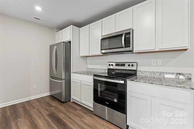 221 Century Dr, Salisbury, NC 28147 - kitchen featuring visible vents, white cabinets, appliances with stainless steel finishes, dark wood finished floors, and light stone countertops