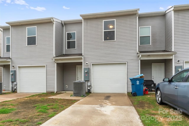 221 Century Dr, Salisbury, NC 28147 - view of property with cooling unit, driveway, and a garage