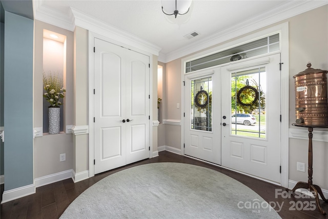 12942 Blakemore Ave, Huntersville, NC 28078 - entryway featuring dark wood-style flooring, baseboards, visible vents, and crown molding