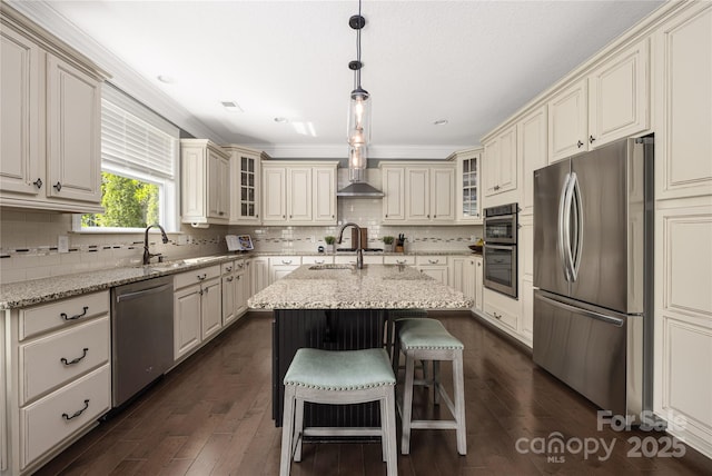 12942 Blakemore Ave, Huntersville, NC 28078 - kitchen featuring an island with sink, cream cabinetry, appliances with stainless steel finishes, and a sink