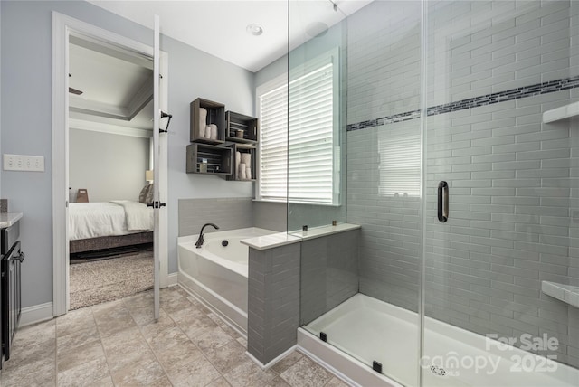 12942 Blakemore Ave, Huntersville, NC 28078 - full bathroom with a bath, a shower stall, baseboards, and connected bathroom