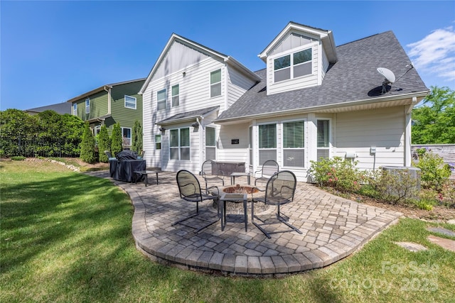 12942 Blakemore Ave, Huntersville, NC 28078 - back of house with a patio area, a lawn, board and batten siding, a shingled roof, and a fire pit