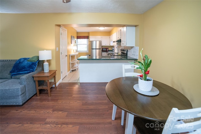 dining space with light wood-type flooring