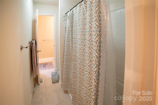 full bath featuring a shower with curtain and tile patterned floors