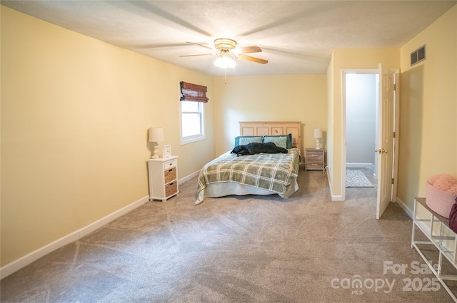 bedroom featuring carpet flooring, visible vents, baseboards, and ceiling fan