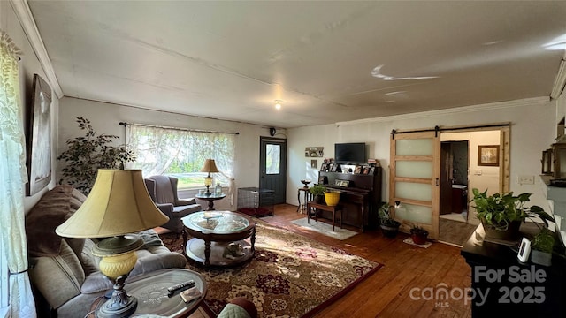 2118 Polkville Rd, Shelby, NC 28150 - living area with a barn door, hardwood / wood-style floors, and ornamental molding