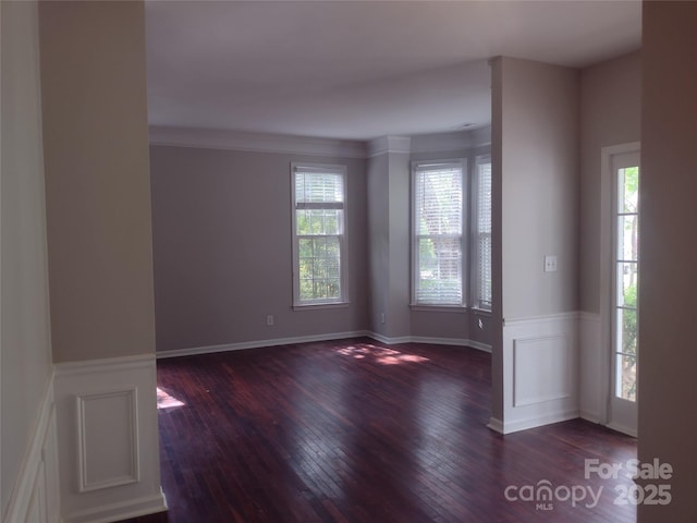 unfurnished room featuring hardwood / wood-style flooring