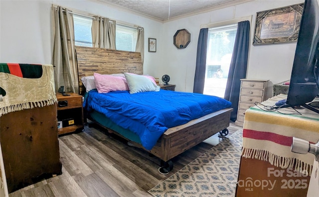 1306 Brantley Rd, Kannapolis, NC 28083 - bedroom with crown molding, wood finished floors, multiple windows, and a textured ceiling