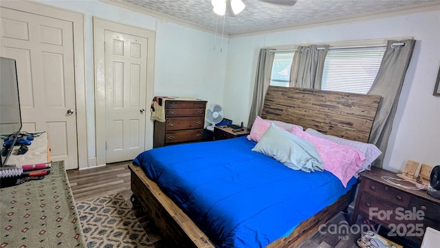 1306 Brantley Rd, Kannapolis, NC 28083 - bedroom with wood finished floors, crown molding, and a ceiling fan