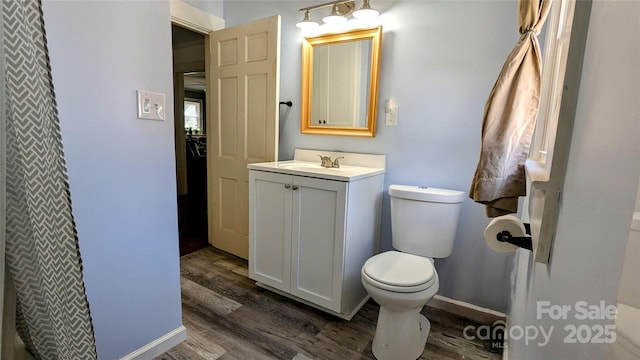 1306 Brantley Rd, Kannapolis, NC 28083 - bathroom featuring wood finished floors, toilet, and vanity
