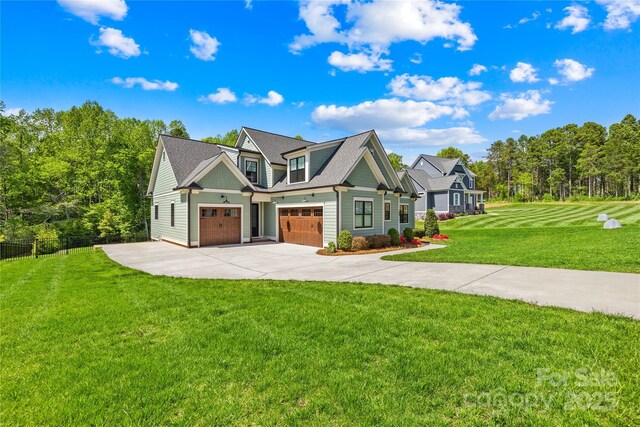 108 Castleview Ln, Mooresville, NC 28115 - view of front of home with fence, an attached garage, a front lawn, and concrete driveway