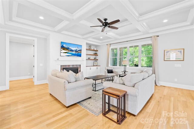 108 Castleview Ln, Mooresville, NC 28115 - living area featuring baseboards, light wood-style floors, coffered ceiling, a ceiling fan, and a fireplace