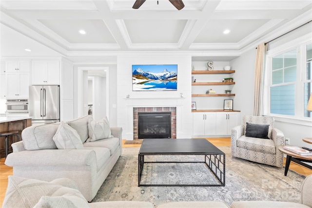108 Castleview Ln, Mooresville, NC 28115 - living room featuring ceiling fan, coffered ceiling, light wood finished floors, and a fireplace