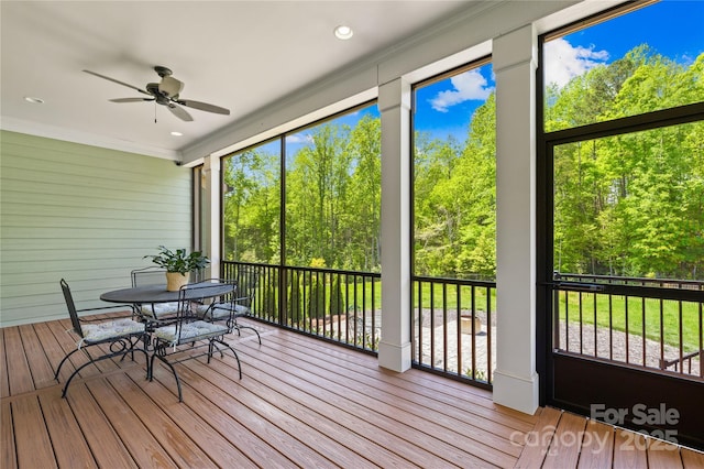 108 Castleview Ln, Mooresville, NC 28115 - sunroom with wood walls, a ceiling fan, wood finished floors, and crown molding
