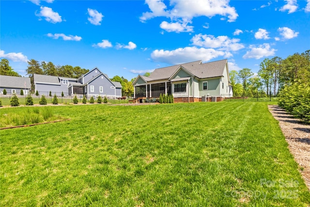108 Castleview Ln, Mooresville, NC 28115 - rear view of house with fence, a sunroom, and a yard