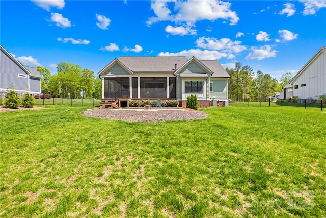 108 Castleview Ln, Mooresville, NC 28115 - rear view of house with a sunroom, a fenced backyard, and a lawn