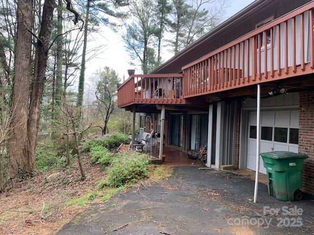 101 Lakemont Dr, Flat Rock, NC 28731 - view of side of home featuring a garage and a deck