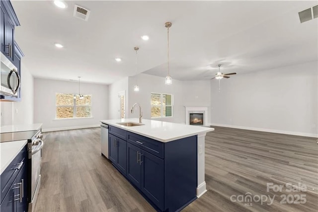 1469 Mocksville Hwy Unit 21, Statesville, NC 28625 - kitchen featuring appliances with stainless steel finishes, a sink, ceiling fan, dark wood-style floors, and baseboards