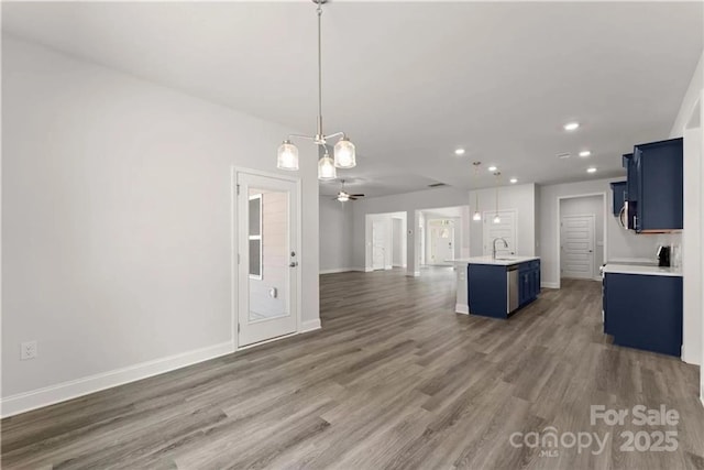 1469 Mocksville Hwy Unit 21, Statesville, NC 28625 - unfurnished living room with recessed lighting, wood finished floors, baseboards, a sink, and a ceiling fan