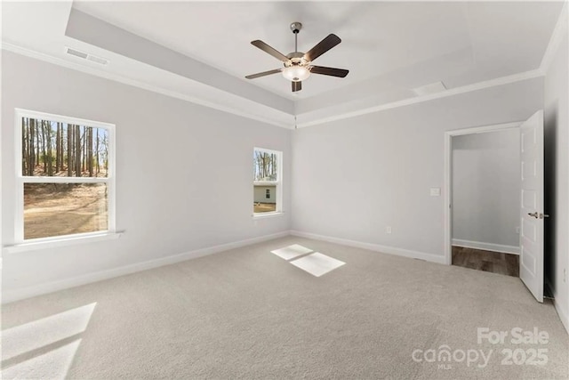 1469 Mocksville Hwy Unit 21, Statesville, NC 28625 - carpeted empty room featuring a raised ceiling, a ceiling fan, baseboards, and crown molding