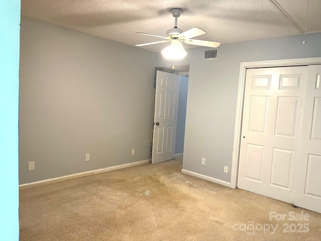 5810 Harris Grove Ln, Charlotte, NC 28212 - unfurnished bedroom with attic access, visible vents, a textured ceiling, and light colored carpet