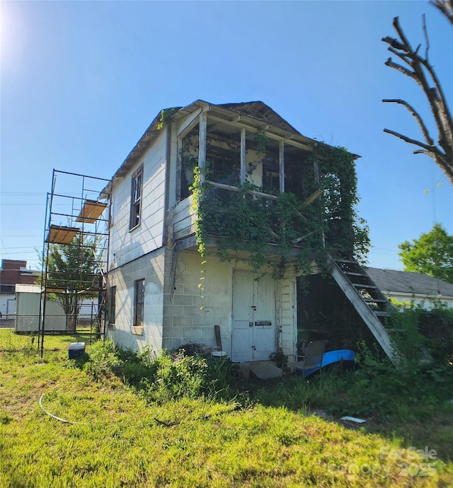 view of home's exterior featuring fence
