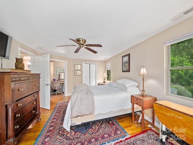 19 Old Patton Hill Rd, Swannanoa, NC 28778 - bedroom with light wood-type flooring, a ceiling fan, a closet, and baseboards