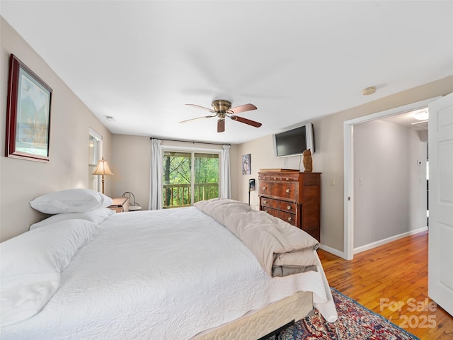 19 Old Patton Hill Rd, Swannanoa, NC 28778 - bedroom featuring light wood-style flooring, a ceiling fan, and baseboards